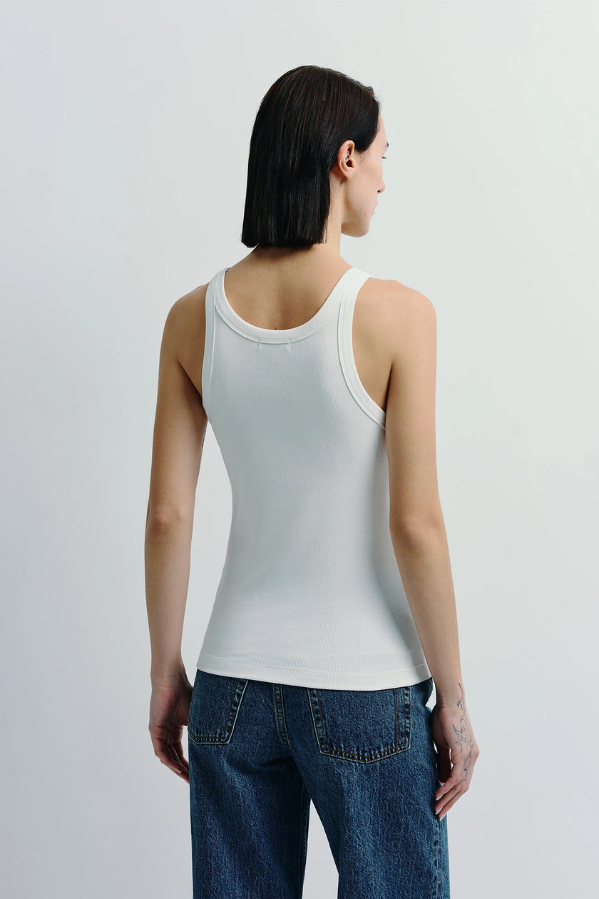 White Luka Ribbed Tank on a model, cotton-viscose blend tank top, paired with denim jeans, Ruesophie.