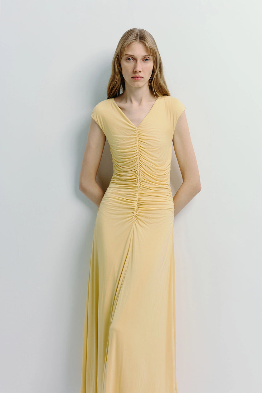 Mille Rouched Midi Dress in pale yellow with ruched center detail and flowy silhouette