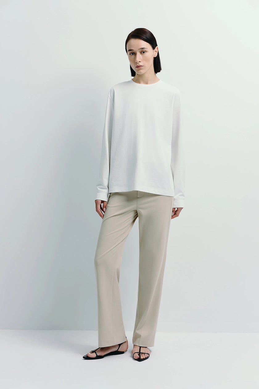 Beige Parker Straight Leg Pant with white long-sleeve shirt, cotton-lyocell blend, a versatile wardrobe choice.