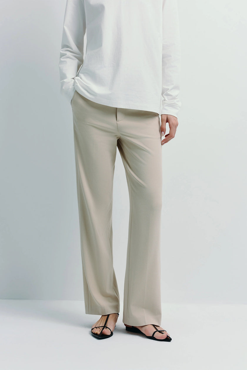 Beige Parker Straight Leg Pants with white long sleeve, regular fit, versatile wardrobe.