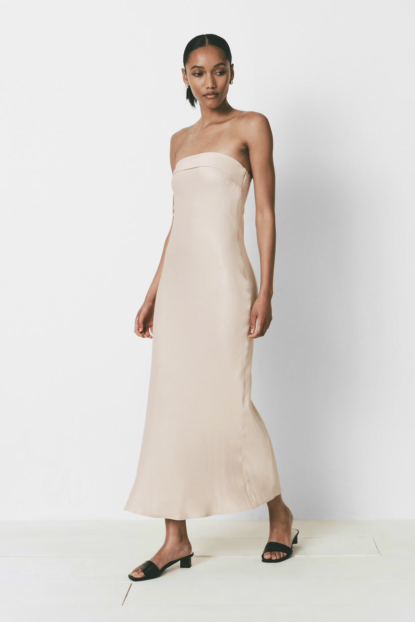 Fête Dress in beige. Strapless column dress, ankle-length with a hidden side zipper. Silky, lightweight fabric.