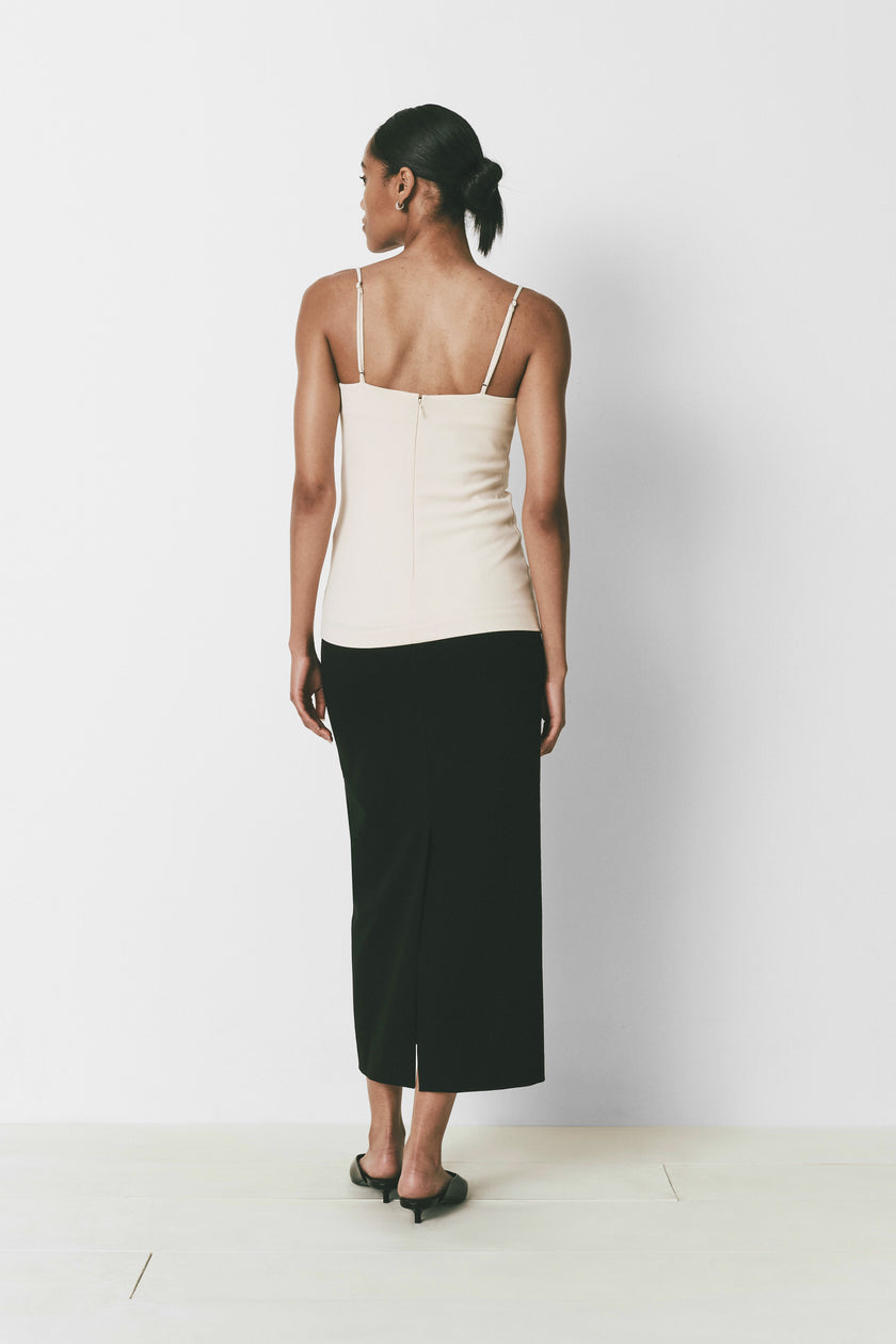 Iles Top back view, cream square neck top with black skirt, minimalist design