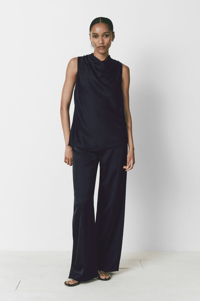 Ruesophie Avignon Cowlneck Top in Black, sleeveless with cowl neck. Soft, lustrous finish. Minimalist design