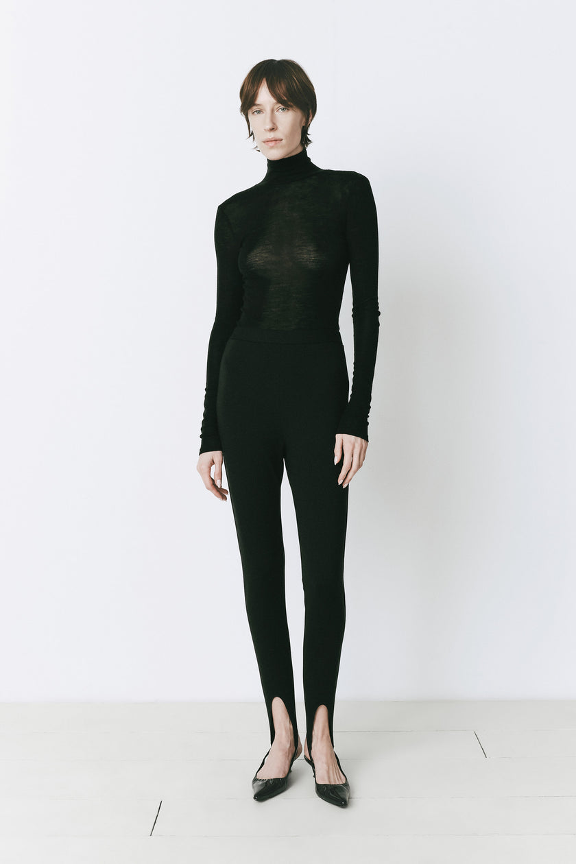 Black rayon blend stirrup pants with a turtleneck, fall fashion