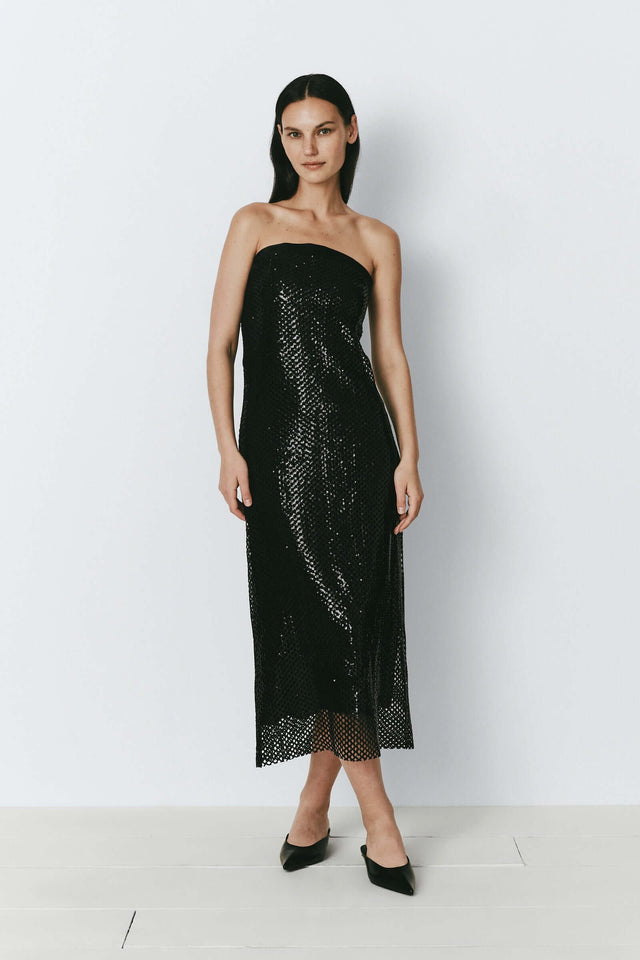 Black sequin crochet mesh dress, ideal for festive events. Standout strapless gown.