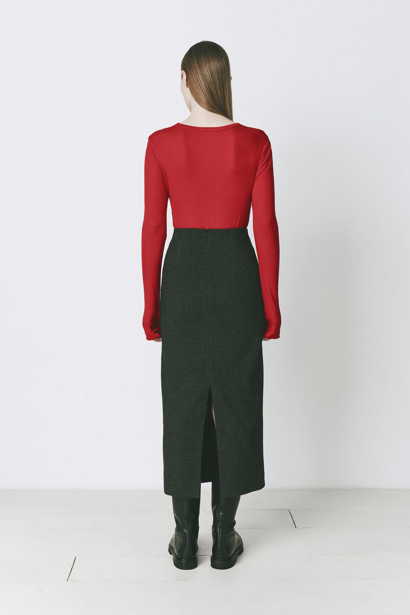 Rouge Clef Long Sleeve Crewneck Top in red paired with a dark green skirt, black boots, perfect for layering.