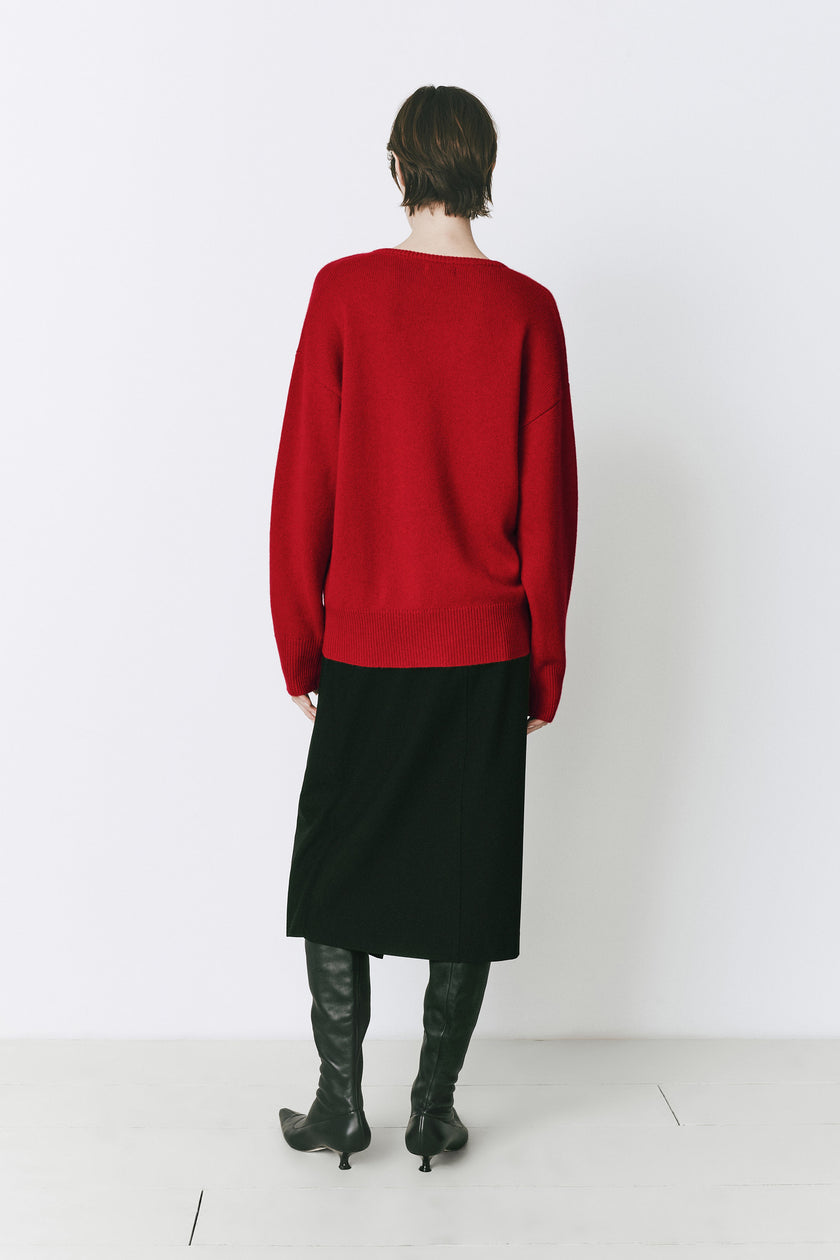 Ruesophie Coquelicot red wool-cashmere sweater, black skirt, and boots fall outfit