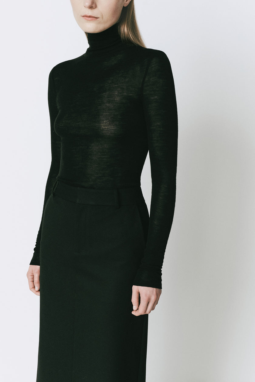 Black Cosette Maxi Skirt and top, crafted from a smooth material, designed for understated elegance and movement.