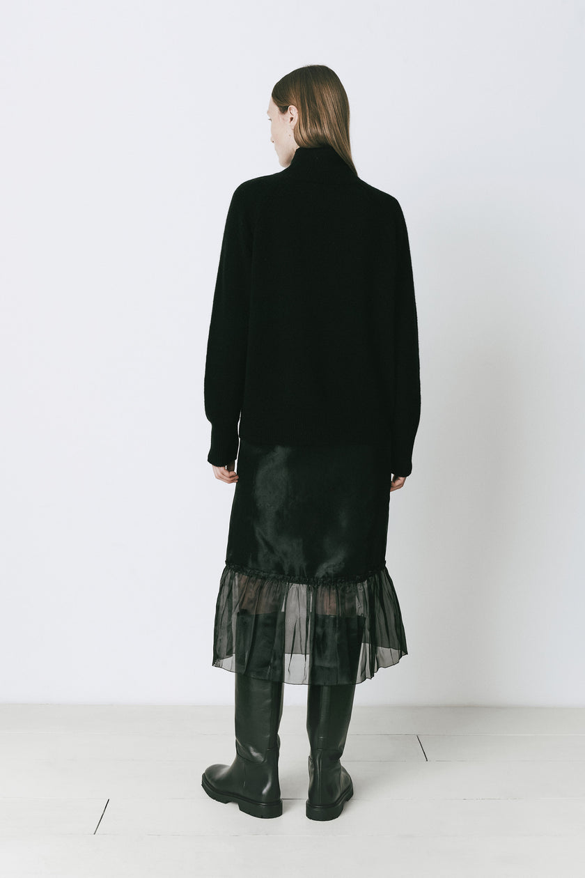 Black Courneuve Mockneck Sweater and black skirt with knee-high boots, wool and cashmere blend