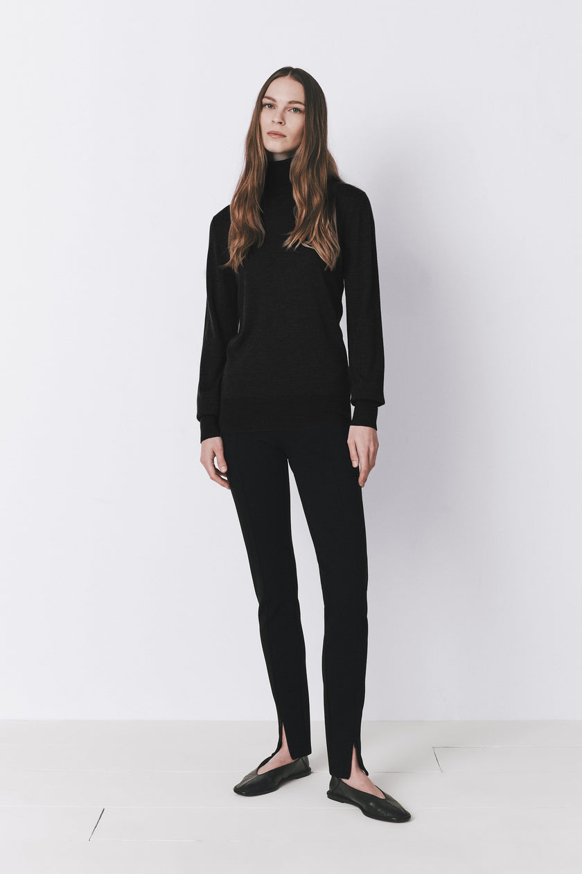 Dion wool & silk black sweater and pants, featuring a turtleneck and split-hem details, luxurious lightweight knit