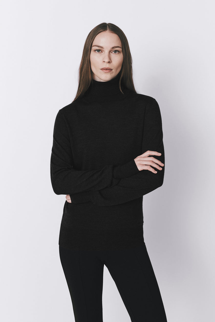 Black wool-silk blend turtleneck sweater and pants, offering gentle warmth and a smooth touch, from Rue Sophie