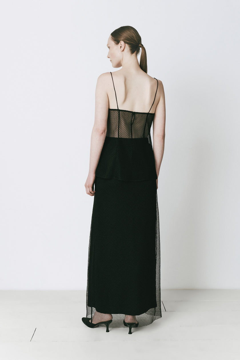 Black Espoir Mesh Skirt with sheer detailing, perfect for layering or evening style