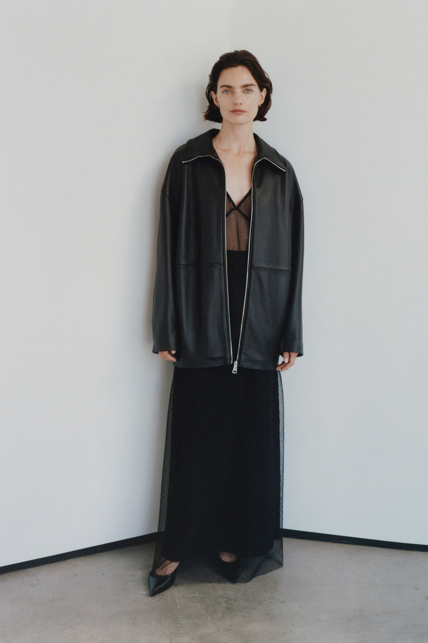 Black leather jacket, mesh skirt ensemble