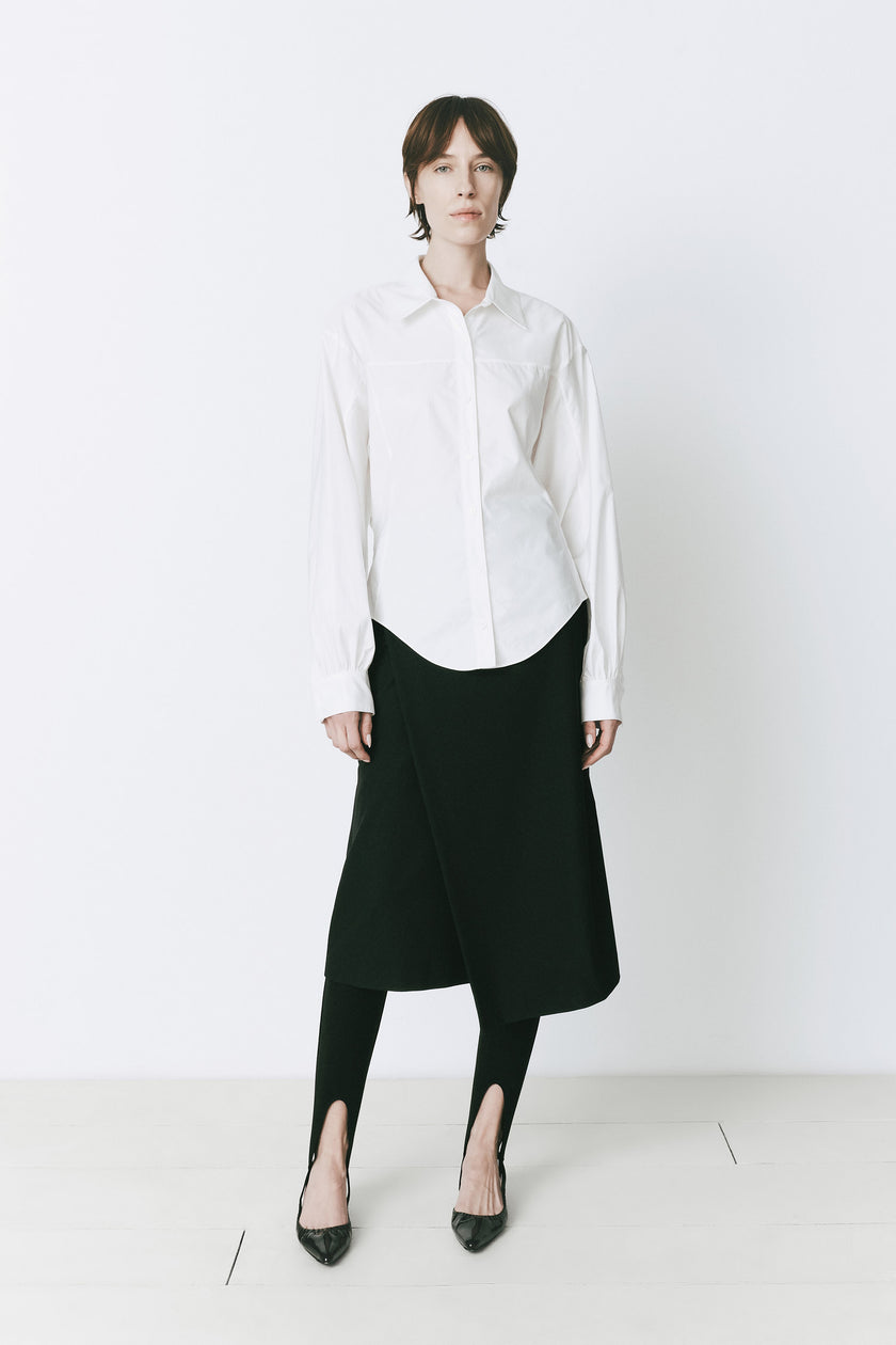 White cotton shirt with balloon sleeves, black skirt and leggings, work or sophisticated style.