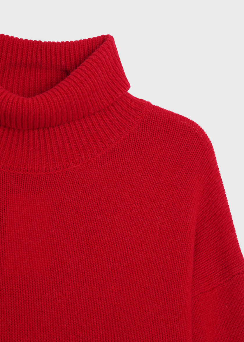 Rouge red wool-cashmere turtleneck sweater. Loose fit, ribbed collar, and cozy design for fall.