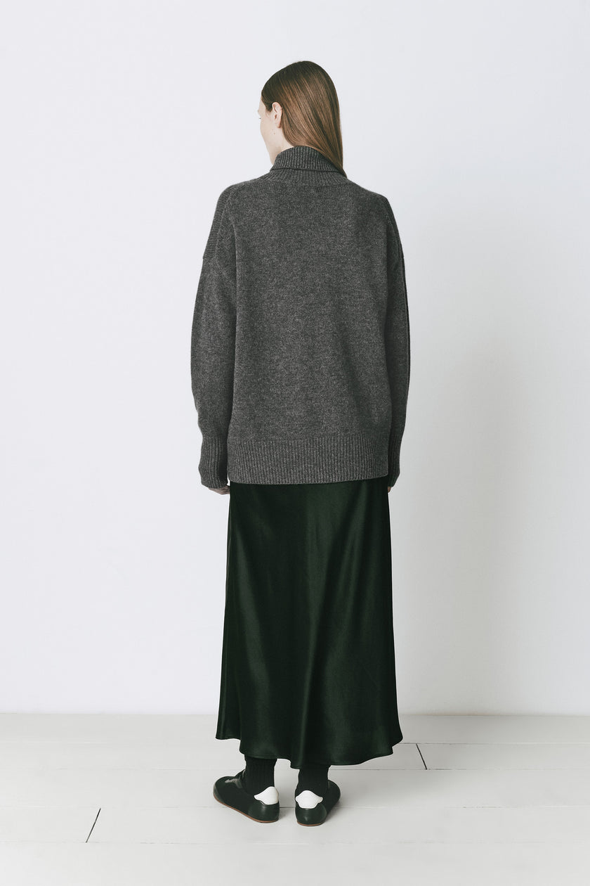 Oversized Cinder turtleneck sweater with dark green skirt, winter wear by Ruesophie