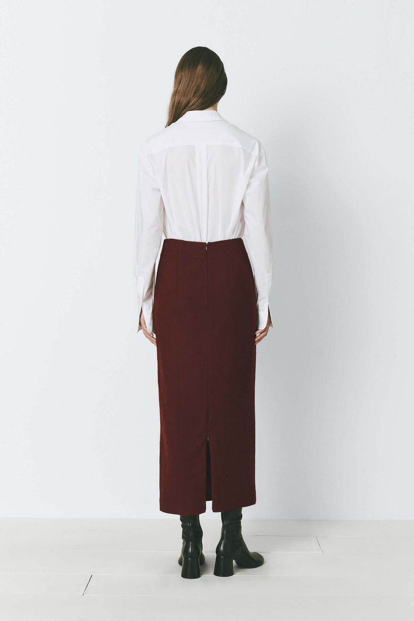 Bordeaux wool blend pencil skirt with back zip, white shirt, and black boots. A refined look