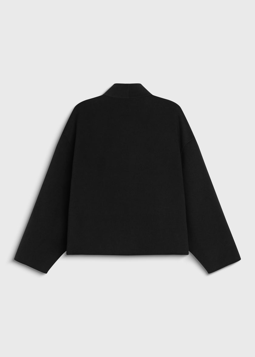 Back view of the Jaurès Shawl Collar Jacket in black wool-cashmere, showcasing its relaxed fit and collar detail.