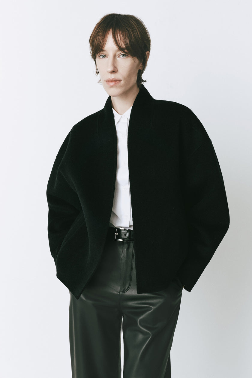 Black wool-cashmere Jaurès Shawl Collar Jacket on a woman, perfect for fall outings