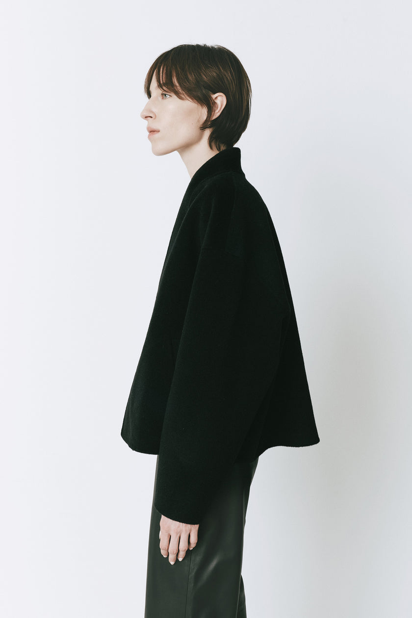 Black wool-cashmere Jaurès Shawl Collar Jacket with leather pants. Perfect for fall layering.