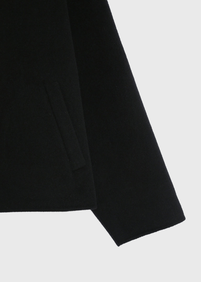 Black wool-cashmere Jaurès Jacket, detail of fabric and pocket.