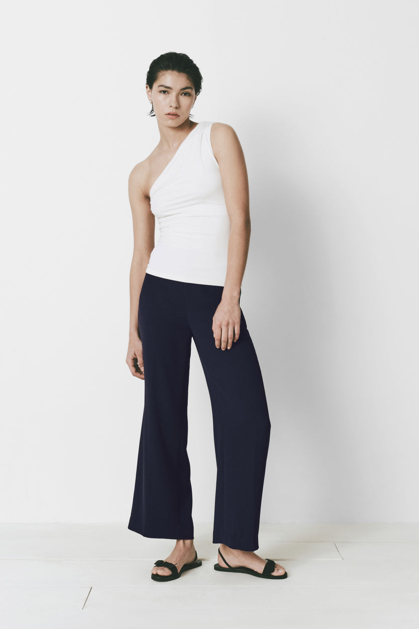 Le Champ Top in white, one-shoulder top, soft fabric with navy pants - Rue Sophie