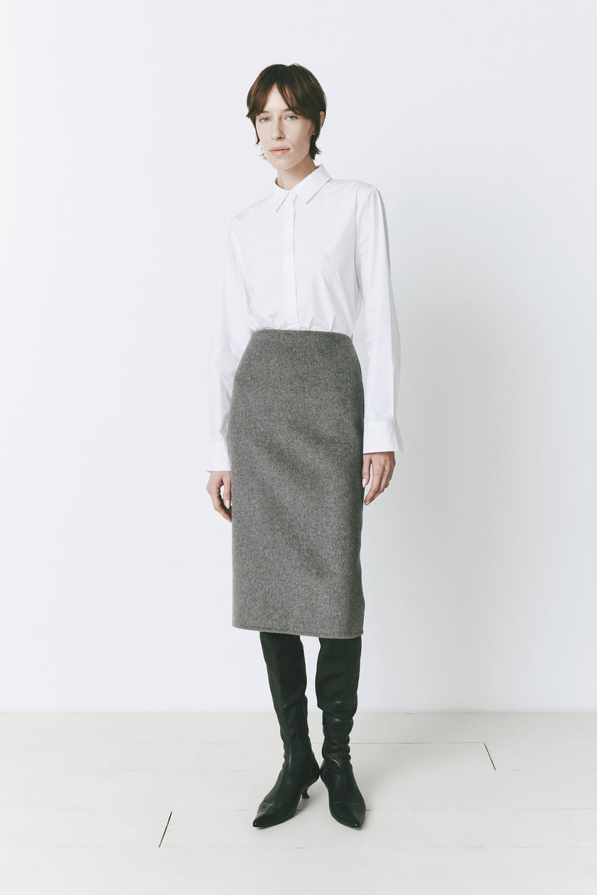 Ruesophie Le Marais wool-cashmere midi skirt, white shirt and black boots. Sophisticated work attire