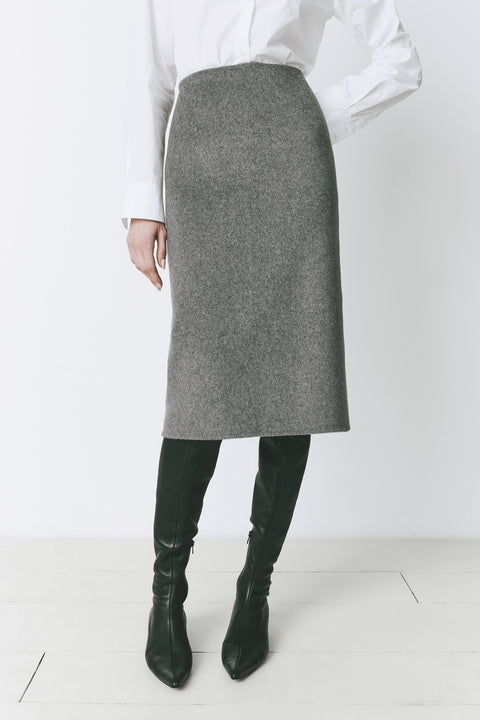 Ruesophie Le Marais Slit Back Skirt, tailored gray wool-cashmere midi skirt, white shirt, and black leather boots