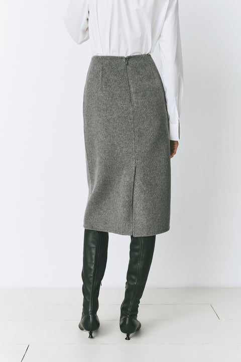 Ruesophie Le Marais gray wool-cashmere midi skirt, back slit, and black boots. Sophisticated work or event attire.