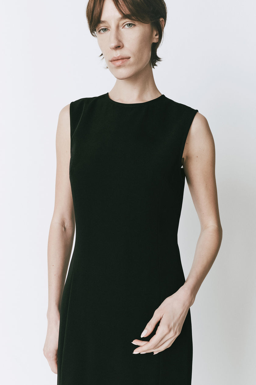 Sleeveless black midi dress, Rue Sophie's Marceau design, ideal for versatile and evening wear.
