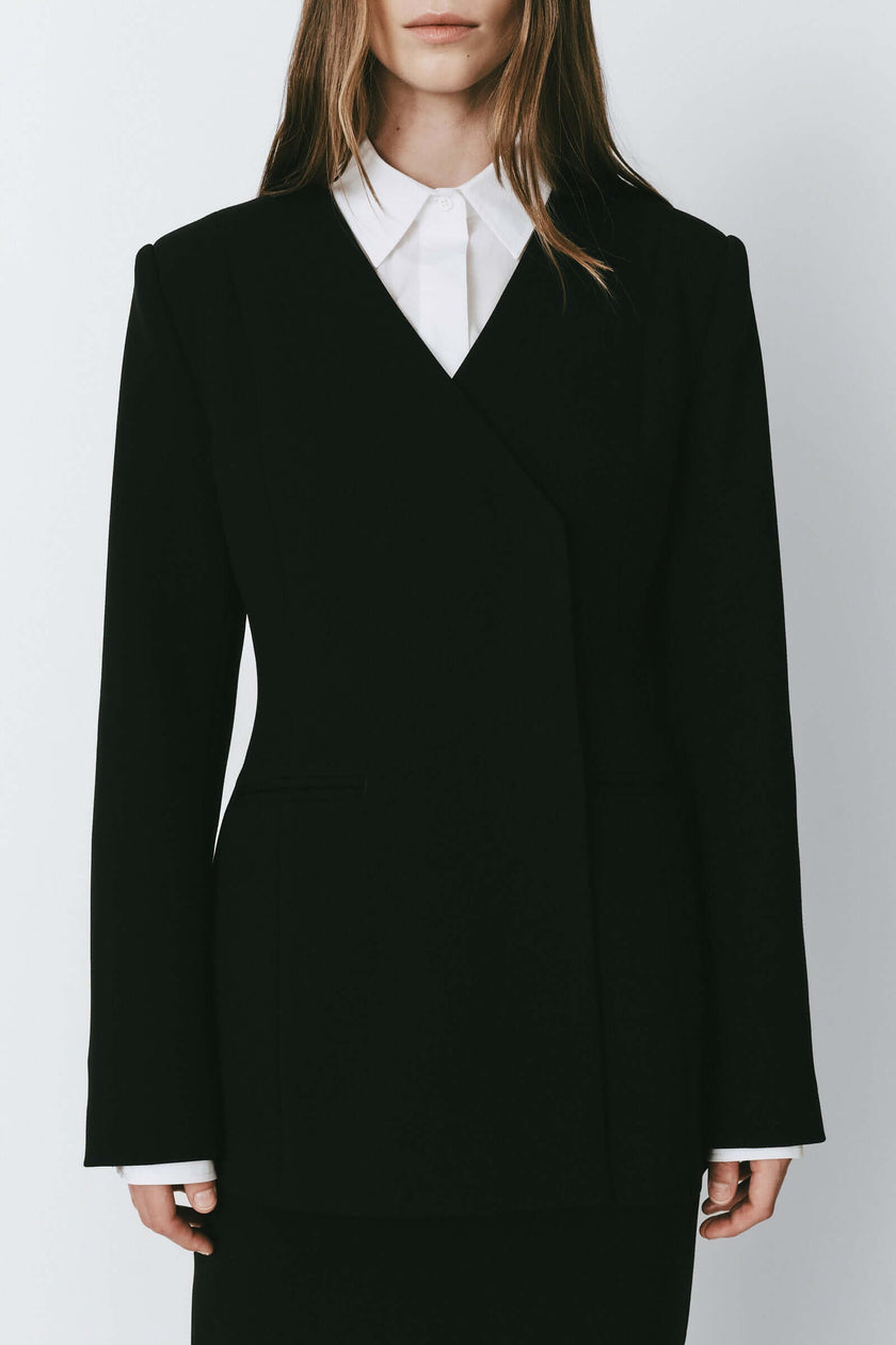 Black Marion Side Slit Jacket. Premium polyester-rayon with a relaxed fit, perfect for day-to-night wear.