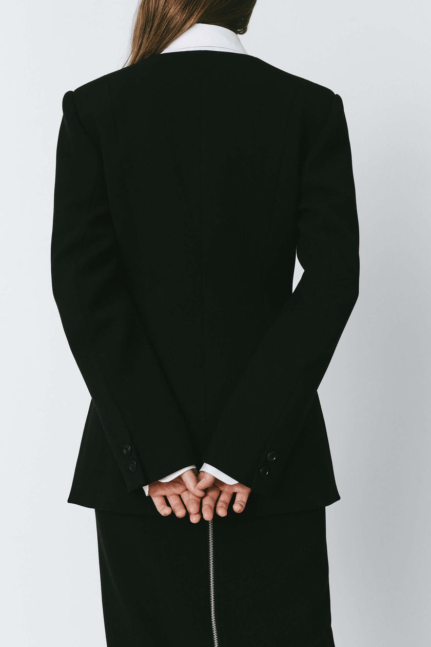 Black Marion Side Slit Jacket, back view. Polyester-rayon blend jacket with side slit.