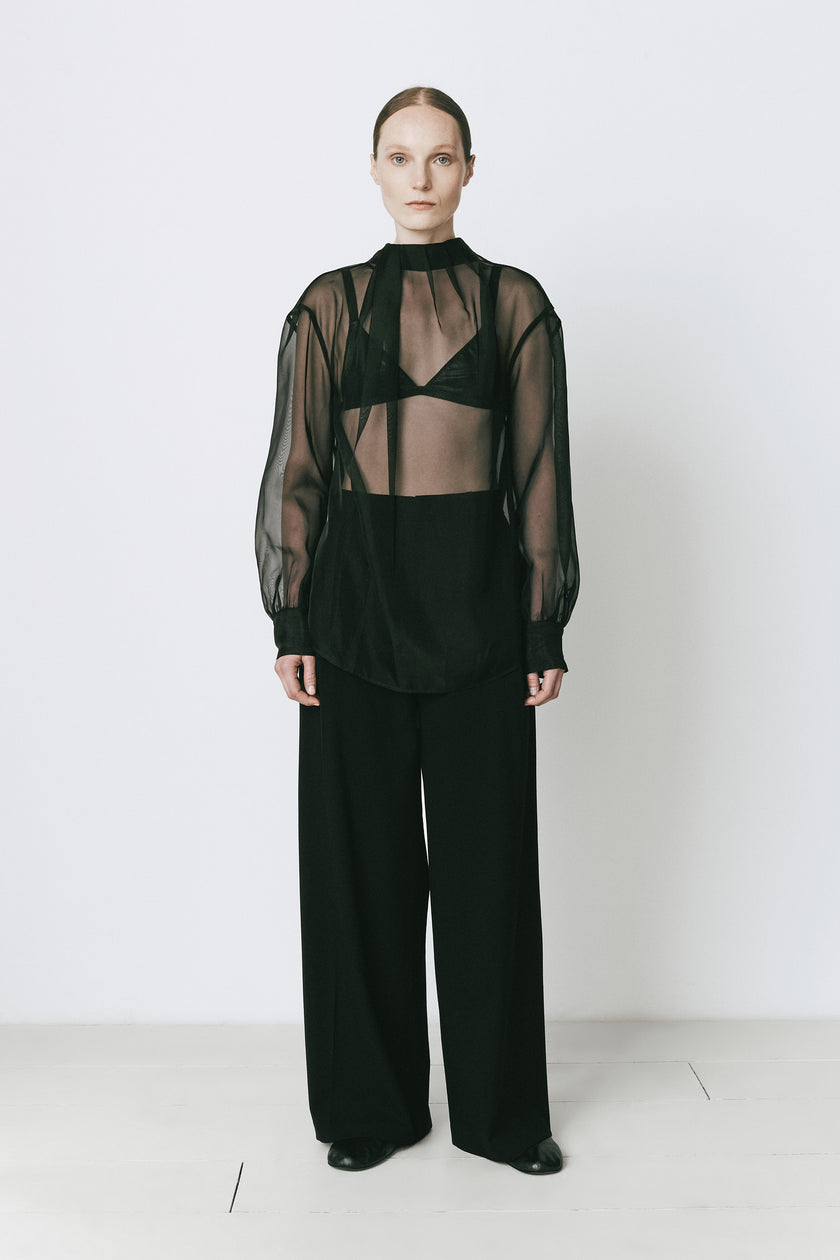 Black sheer organza tie neck top and wide-leg trousers, ideal for evening wear from Ruesophie