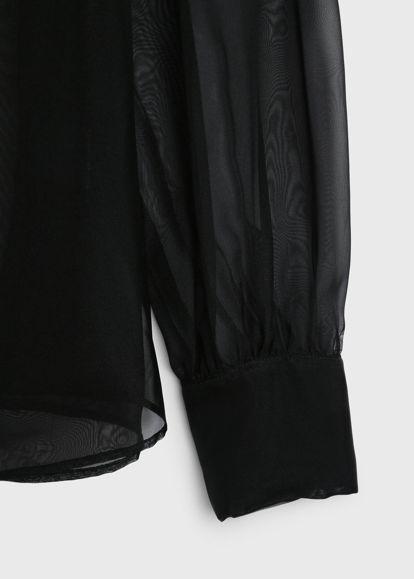 Black organza sleeve detail on a Ruesophie Monnaie Tie Neck Top. Oversized fit for elegant evening wear.