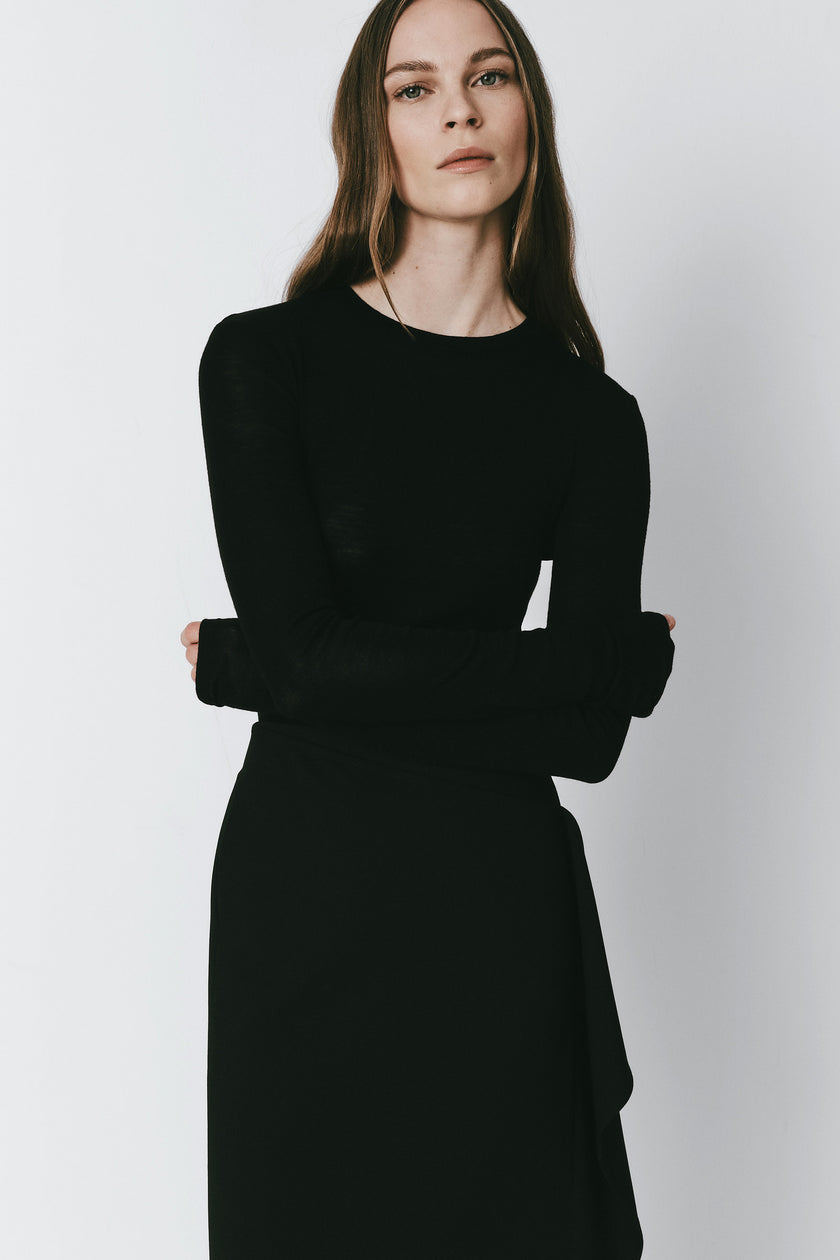Oudine Sheer Wool Top in black. Fitted, elegant, and versatile top, perfect for layering.