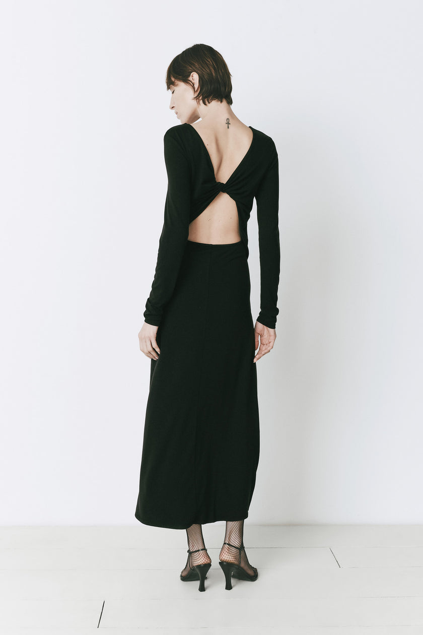 Black René Twist Back Dress with open back detail, long sleeves. Modern woman clothing.
