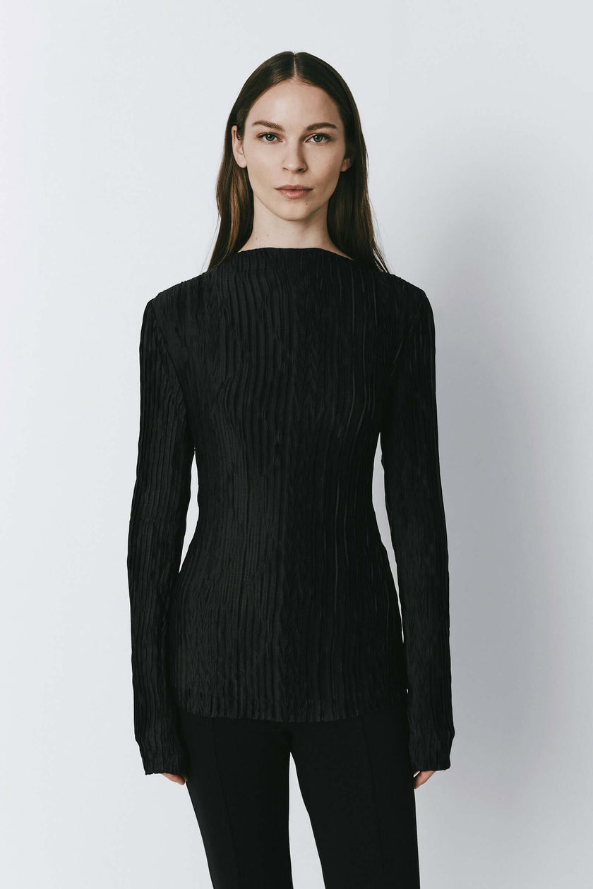 Black Sidonie Pleated Top with textured fabric, form-fitting design, long sleeves.