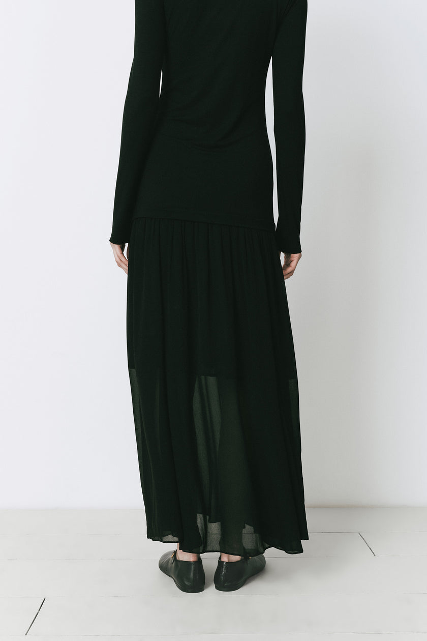 Black Solène maxi dress in viscose blend, featuring a turtleneck, suitable for daytime or evening wear.