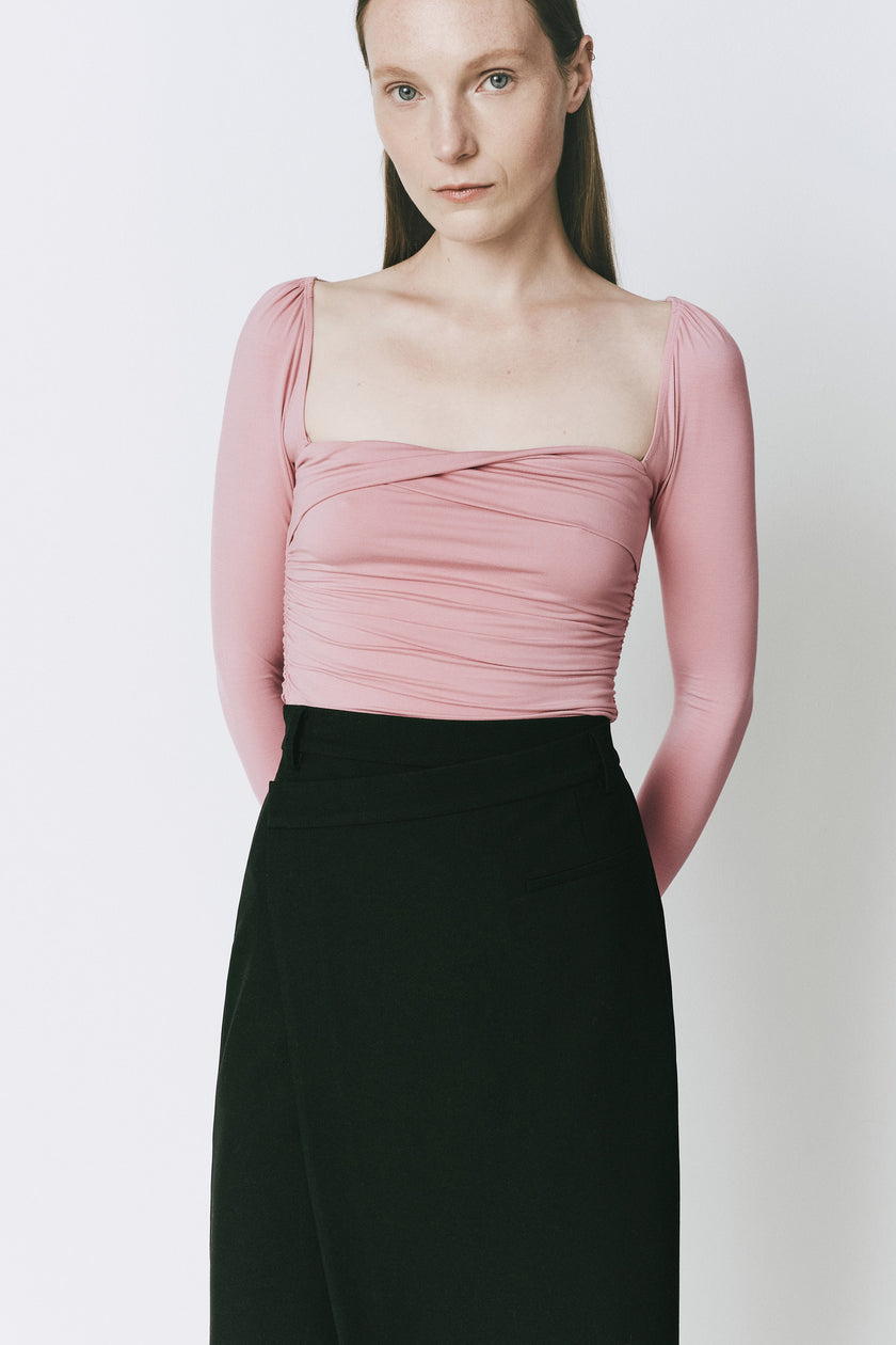 Rose ruched top with black skirt. Slim-fitting, blended modal fabric for a sophisticated look.
