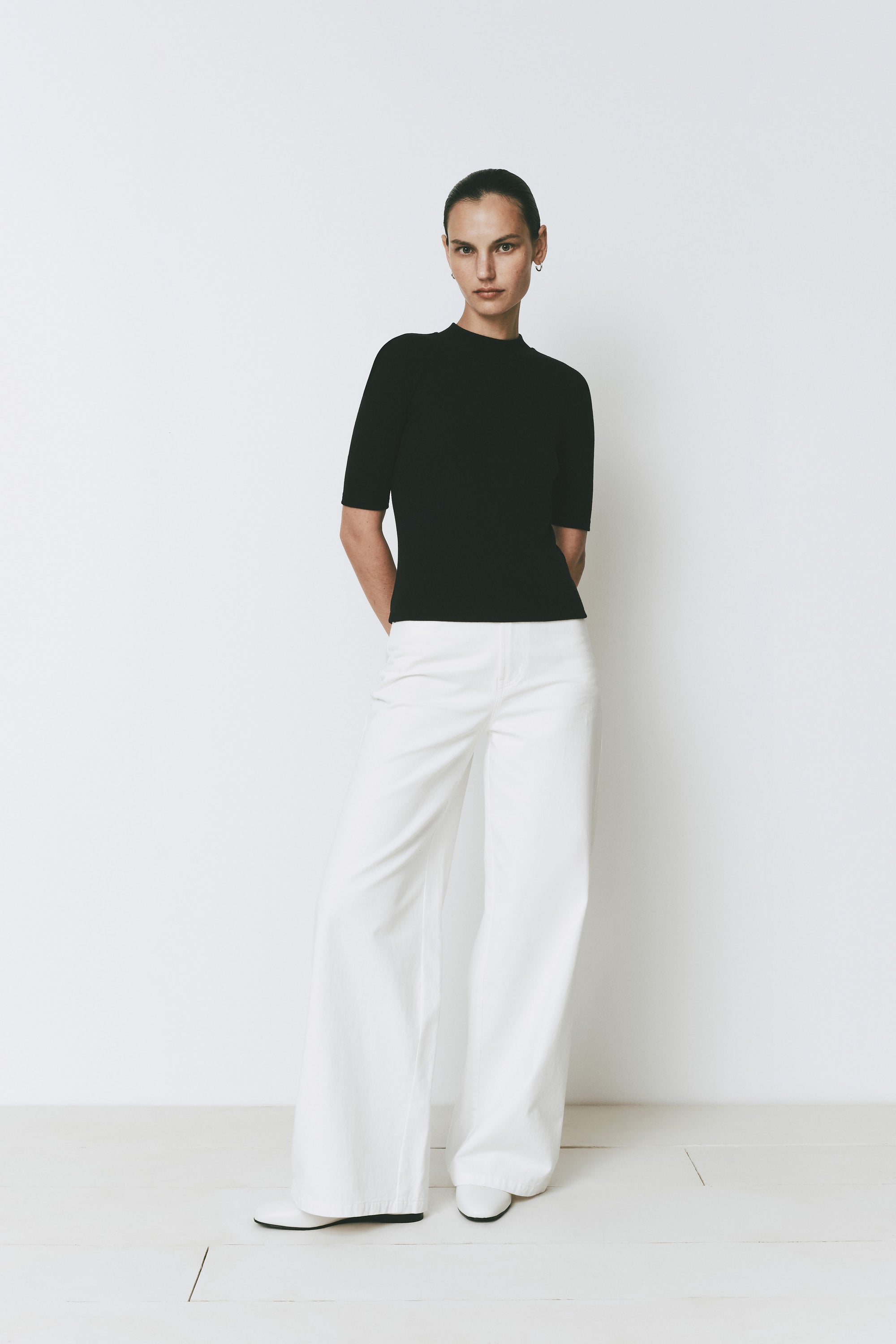 Chabot Mock Neck Top, black quarter sleeve top with white wide-leg pants, relaxed fit, Rue Sophie
