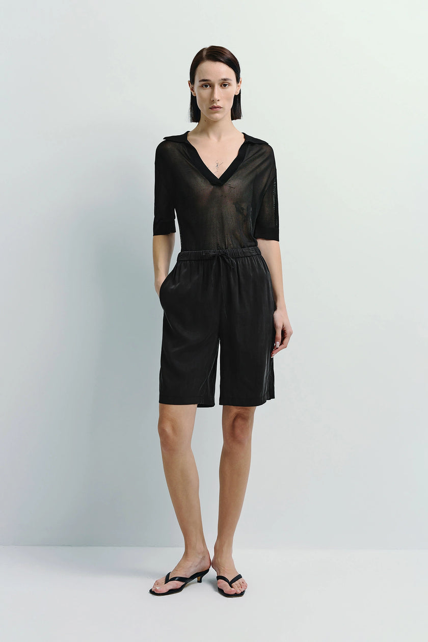 Black Frankie Drawstring Shorts with a V-neck top, silky touch, and relaxed fit.