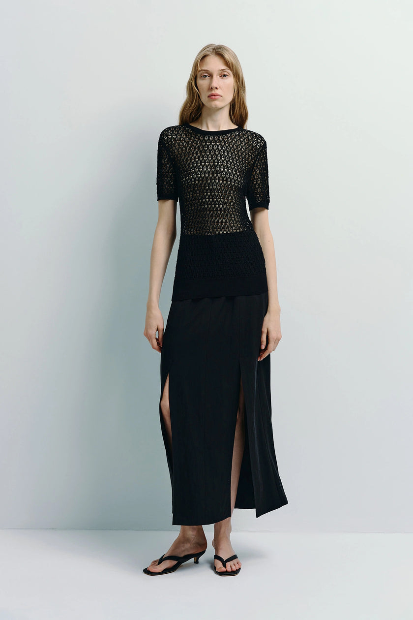 Black Mavis Slit Front Midi Skirt paired with a matching top, sustainable and stylish.