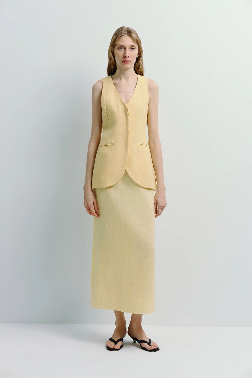Adan Linen Midi Skirt in Light Yellow paired with a matching vest, crafted from breathable linen