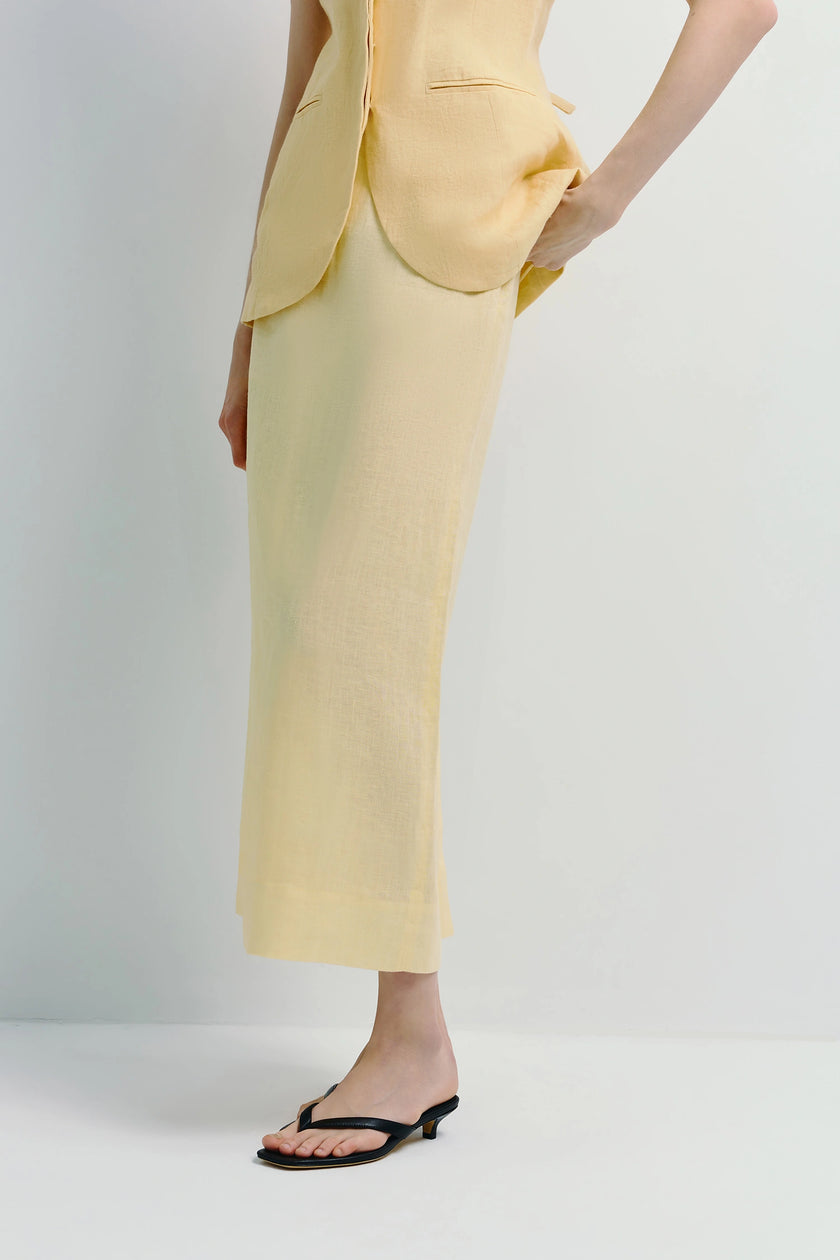 Light yellow linen Adan Midi Skirt paired with a matching vest, elegant summer outfit