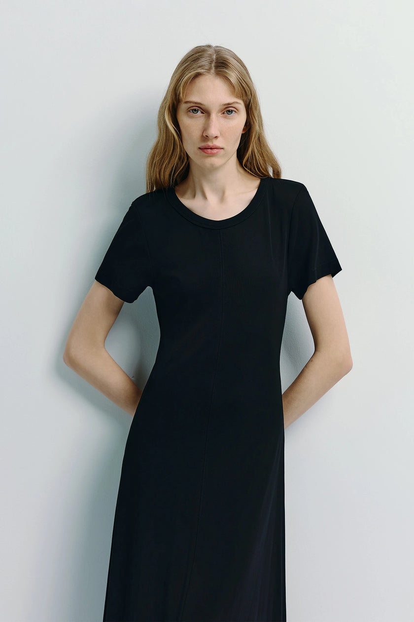 Ciles Drapey Tee Dress in black, featuring crew neck and fluid silhouette.
