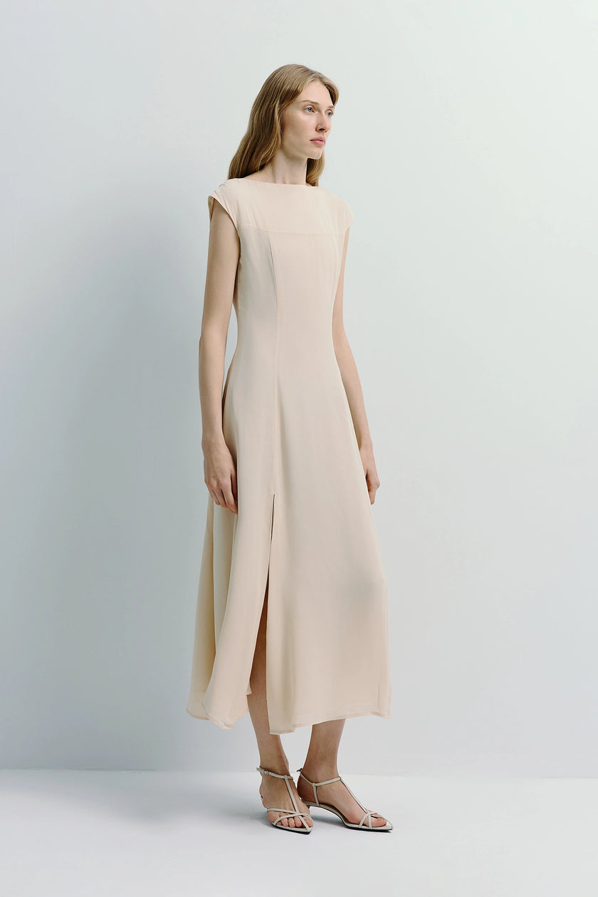 Beige Geordie midi dress with front slit, perfect for spring evenings.