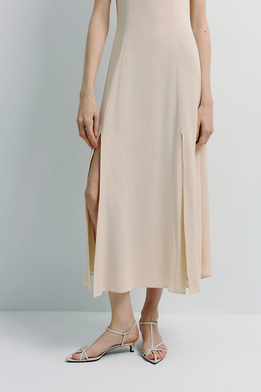 Beige Geordie Slit Front Dress with premium fabric and front slits, perfect for spring evenings