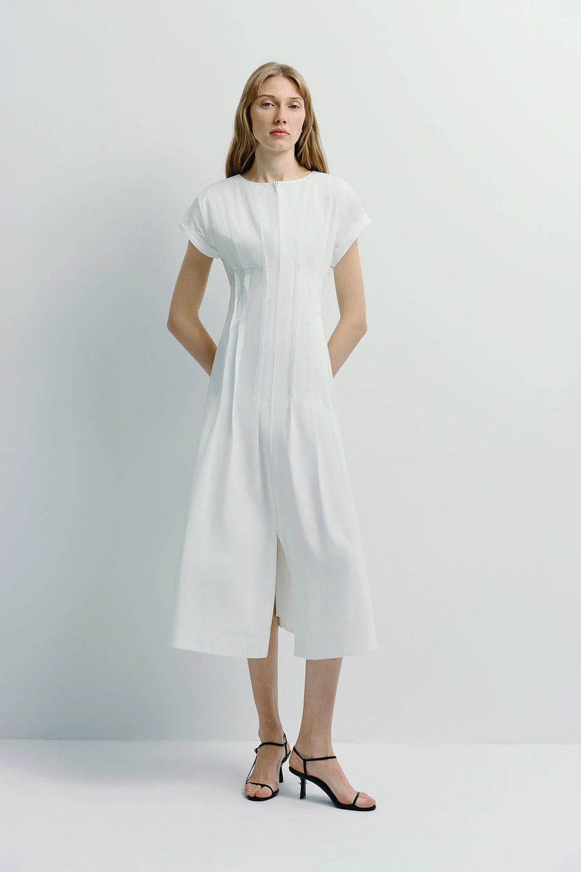White cotton Verri Pintuck Midi Dress with front zipper and pintuck details, styled with black heels