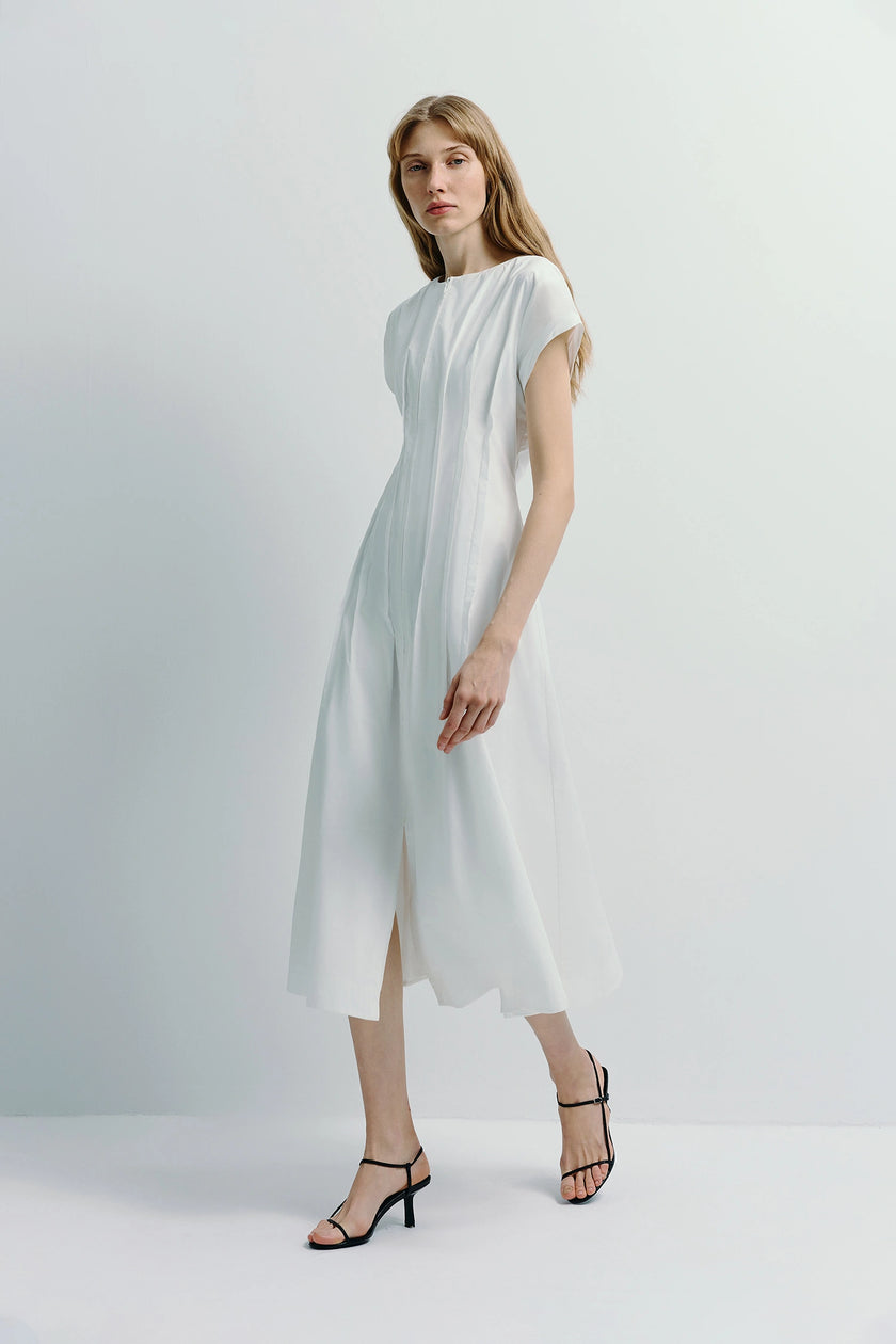 White cotton Verri Pintuck Midi Dress with front zipper and pintuck details, styled with black heels