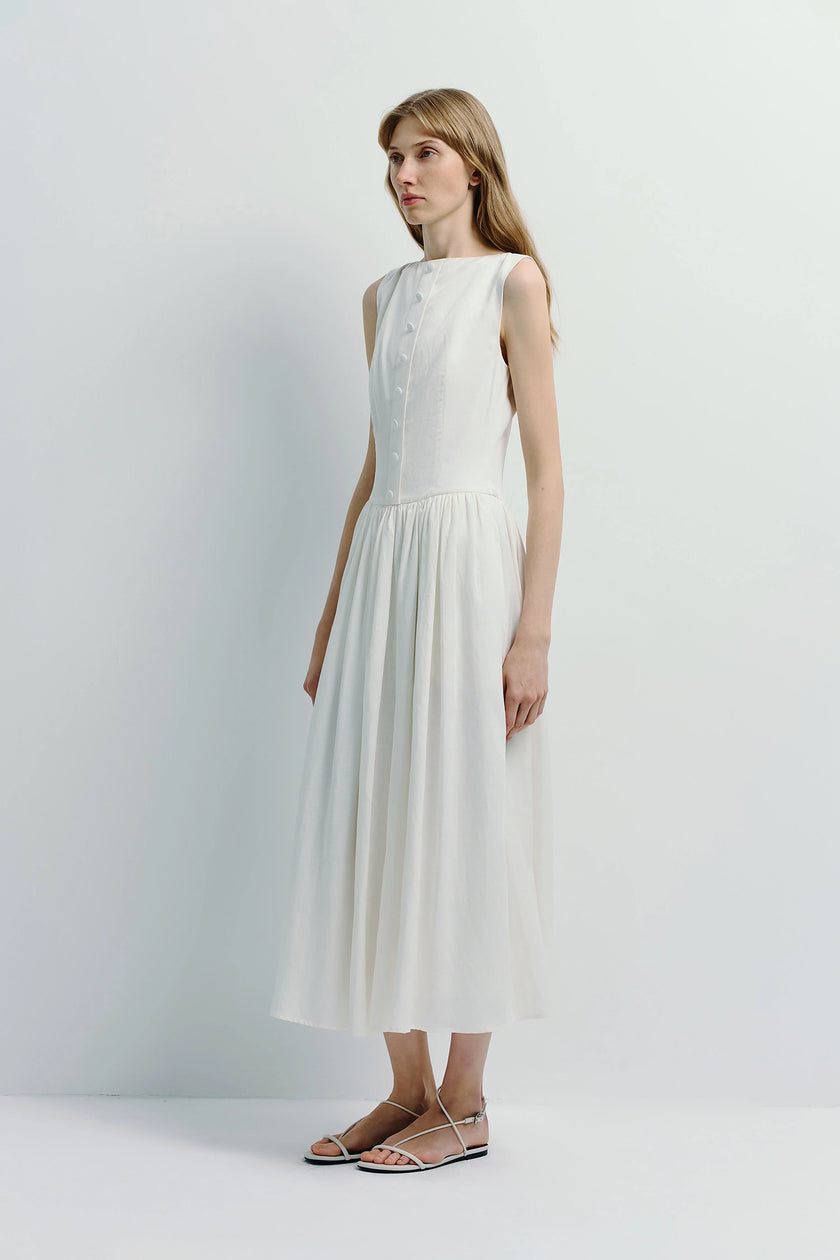 Luiza Button Front Dress in light ivory. Sleeveless A-line dress crafted from a linen-cotton-lyocell blend.